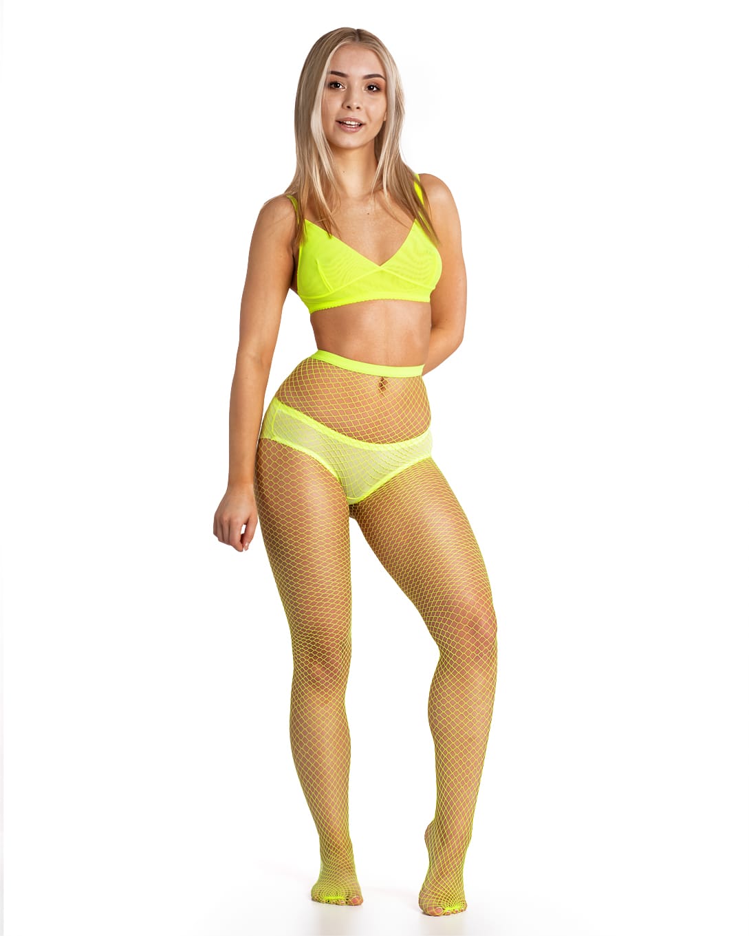 Front view of model wearing neon yellow fishnet tights against a white background. 2